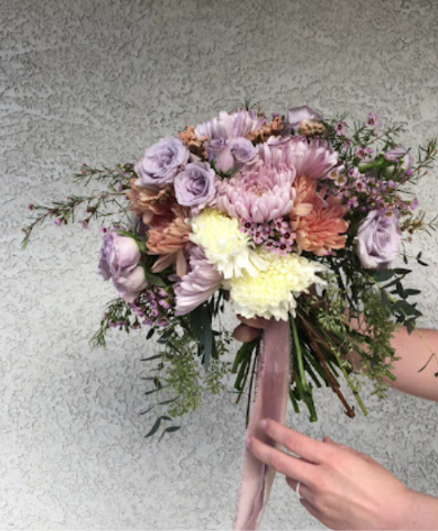 Loose mauve, lavender, peach, and cream hand-tied bouquet